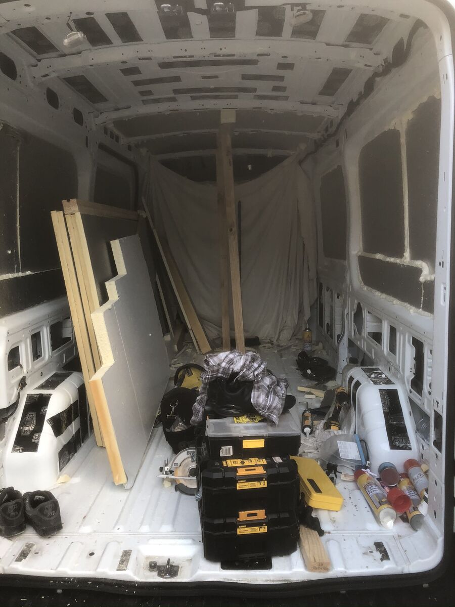 Foil-backed insulation being applied to the walls
